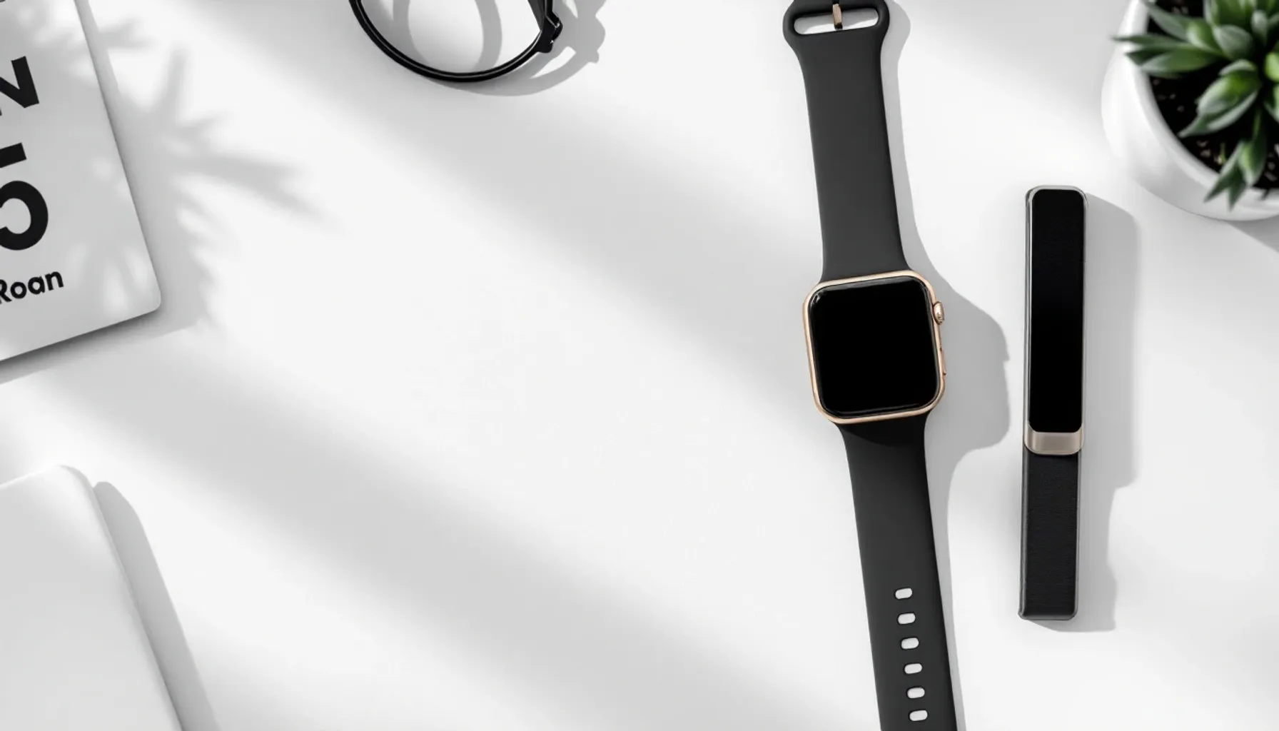 Flat lay of a printed pace band wristband on a white desk next to a runner's watch and race bib, shot from above with so